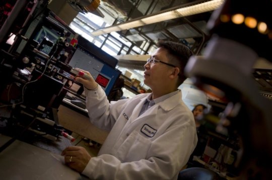 Nanoengineering professor Shaochen Chen 3-D prints a biomimetic blood vessel network.