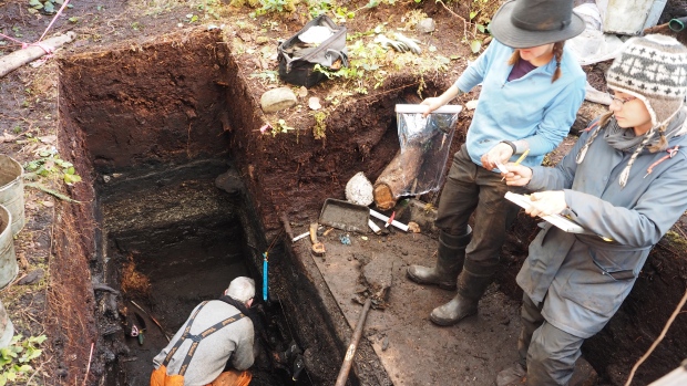 Members of the archeology team, from left to right, John Maxwell, Alisha Gauvreau, and Seonaid Duffield work on excavating the site.