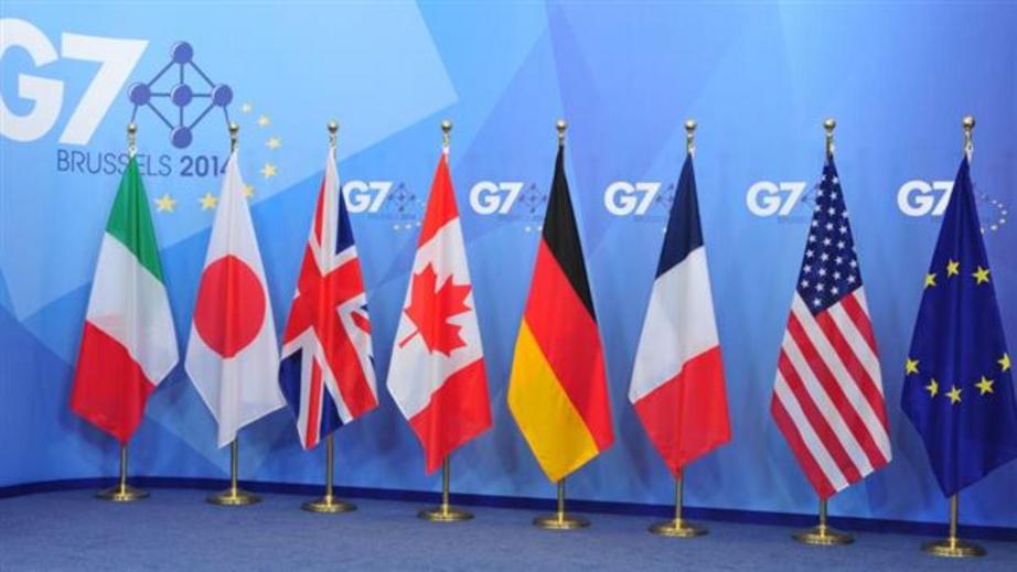 The flags of the Group of Seven countries are set on a stage for an annual summit in Brussels, Belgium (file photo)