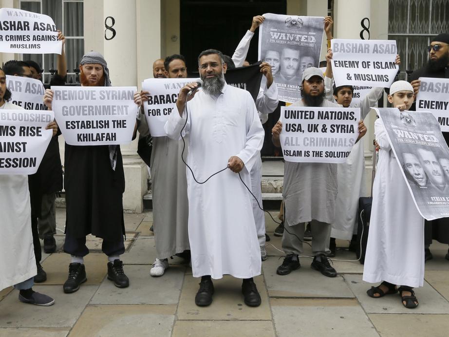 Britain’s top ISIS recruiter, Anjem Choudary, protesting with al-Muhajiroun supporters outside the Syrian embassy in London. Source: Asian World