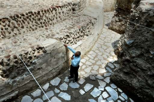 Mexican archaeologist Raul Barerra gives an explanation during a tour by the archaeological site of the ancient Aztec temple of Ehecatl-Quetzalcoatl and ritual ball game recently discovered in downtown Mexico City, on June 7, 2017