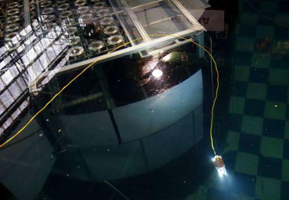A newly developed swimming robot for underwater investigation at a Fukushima's damaged reactor, moves through the water at a Toshiba Corp. test facility in Yokosuka near Tokyo, Thursday, June 15, 2017. The robot, co-developed by the debt-strapped Japanese