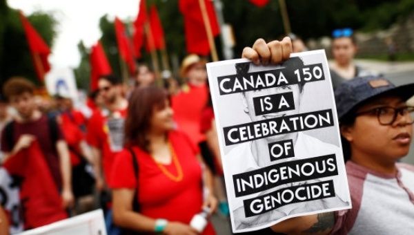 Indigenous-led protests rocked Canada Day this year, resisting colonization and indigenous genocide. | Photo: REUTERS