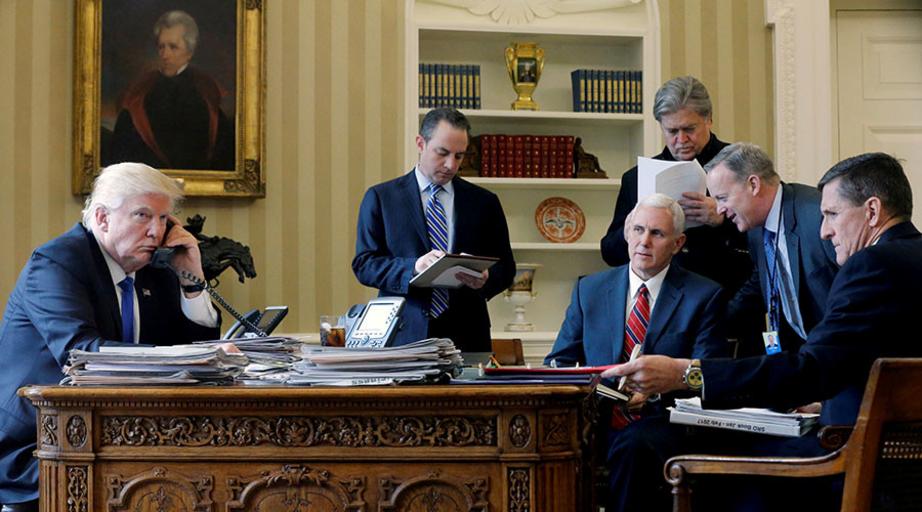 US President Donald Trump is joined by (L-R) Chief of Staff Reince Priebus, Vice President Mike Pence, senior advisor Steve Bannon, Communications Director Sean Spicer and National Security Advisor Michael Flynn as he speaks with Russia’s President Vladim