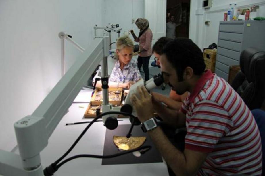 A German-Egyptian team examines objects from the find at the tomb of Tutankhamun.