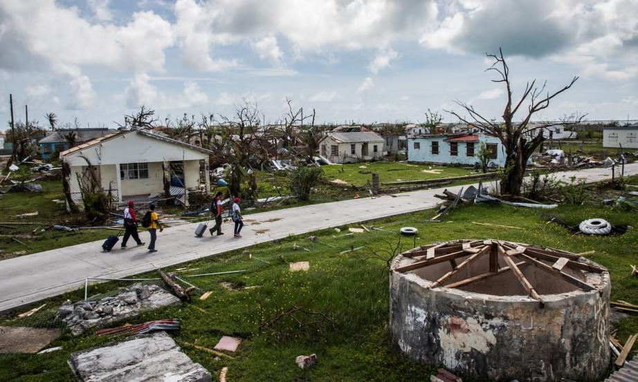  Residents of Codrington and Red Cross workers survey damage on the island of Barbuda in the aftermath of Hurricane Irma. 