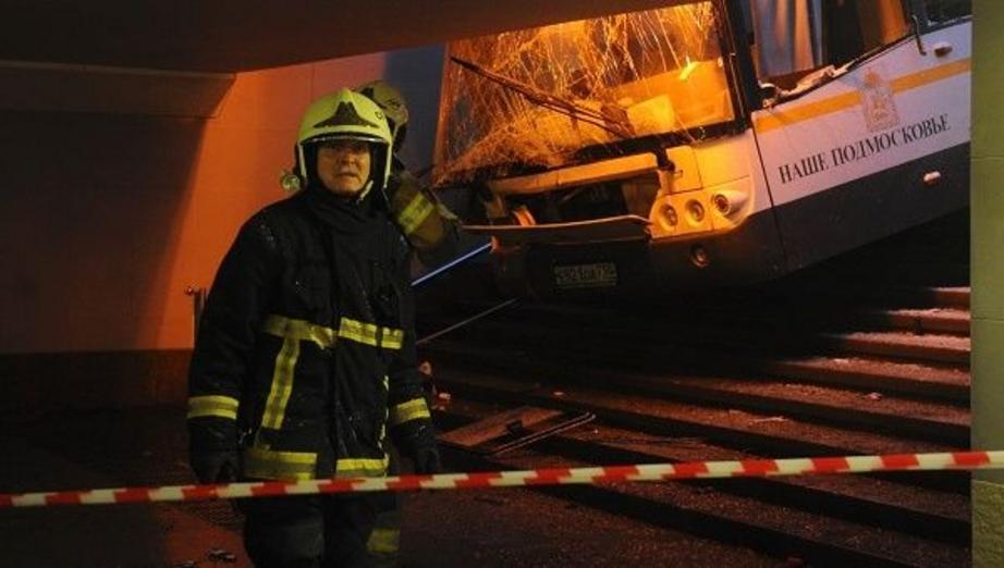 An emergency worker at the scene of an incident involving a bus, which swerved off course and into a busy pedestrian underpass in Moscow. | Photo: Reuters