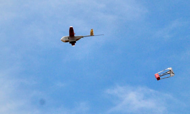  A drone drops its first blood delivery in the compound of Kabgayi hospital, south of Kigali, Rwanda. Photograph: James Akena/Reuters 