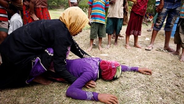 Rohingya refugee woman is consoled after receiving news that her husband was killed in Myanmar. | Photo: Reuters