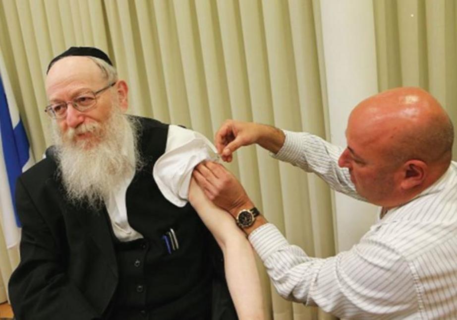 HEALTH MINISTER Yaacov Litzman receives his flu shot from Prof. Itamar Grotto. (photo credit: HEALTH MINISTRY)