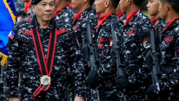 Philippine President Rodrigo Duterte, wearing a military uniform, reviews scout ranger troops upon his arrival during the 67th founding anniversary of the First Scout Ranger regiment in San Miguel town, Bulacan province, north of Manila, Philippines Novem