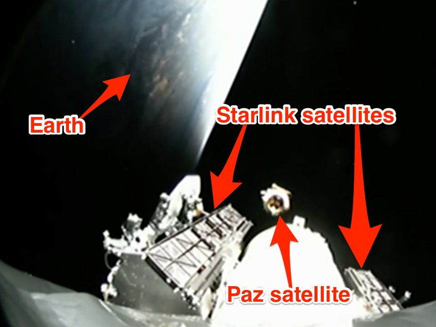 A camera on the second stage of a Falcon 9 rocket shows Earth, the freshly deployed Paz satellite, and two experimental SpaceX satellites, called Microsat-2a and Microsat-2b.