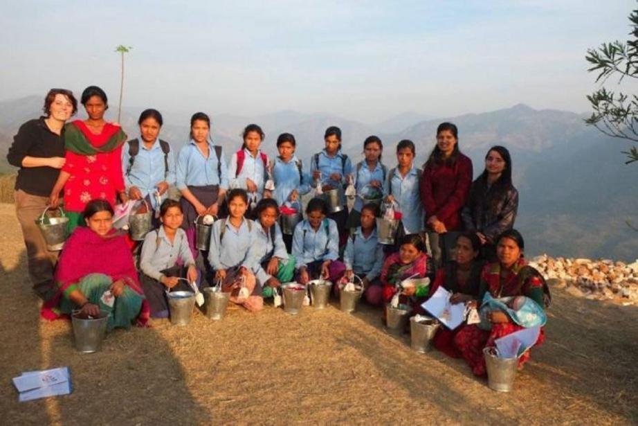 Nepalese school girls receive their reproductive health kits containing menstrual cups in Achham, far-western Nepal.